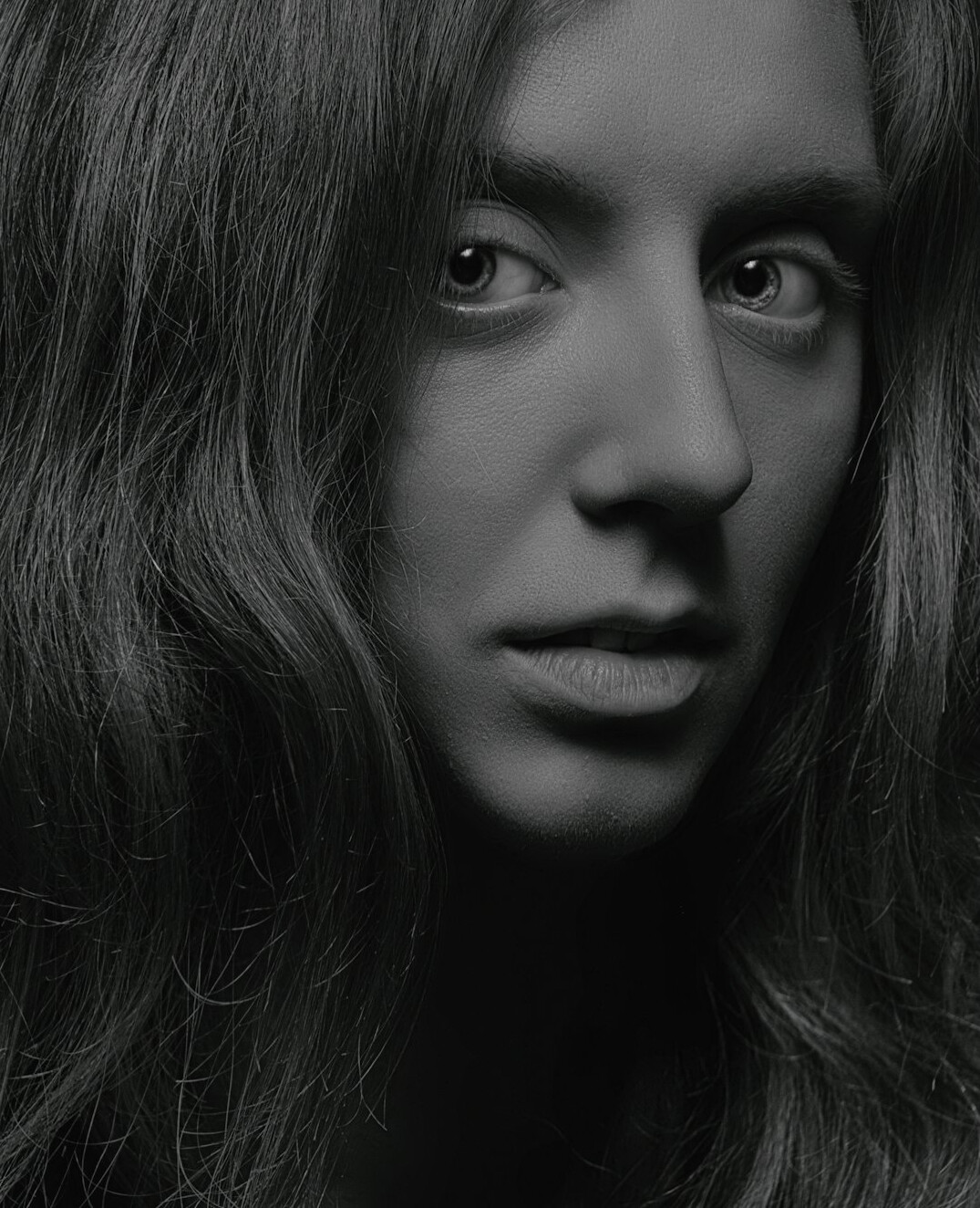 Portrait of a woman with long hair smiling