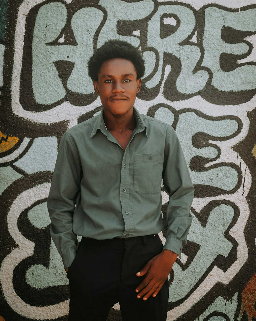 Portrait of a young man in a shirt smiling