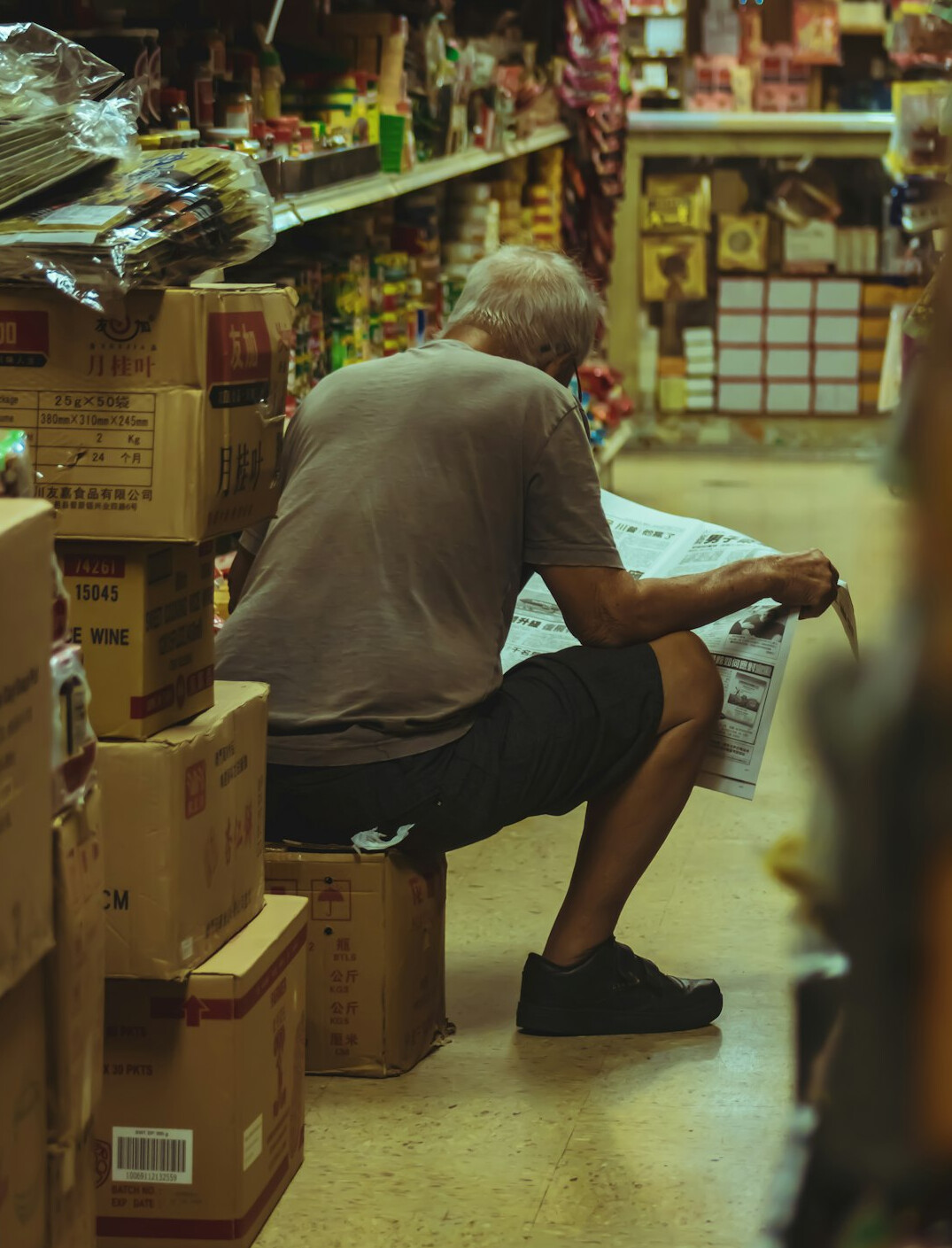 man falling in store