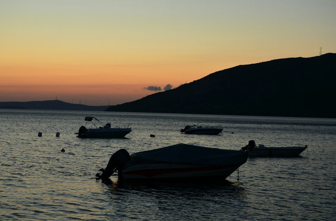 Calm sea and harbor at dusk