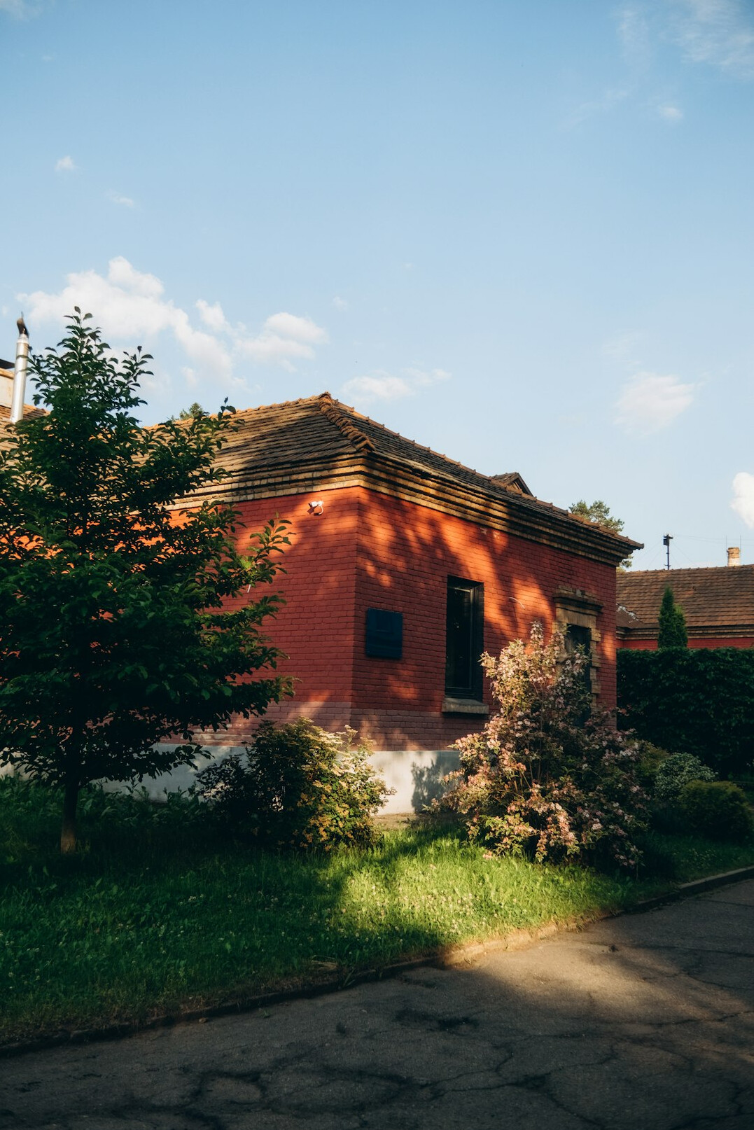 Old house with a garden seen from the street
