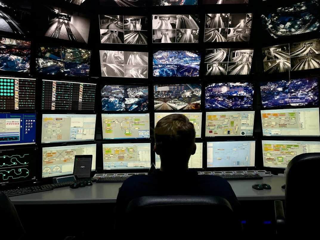 woman security guard monitoring cameras