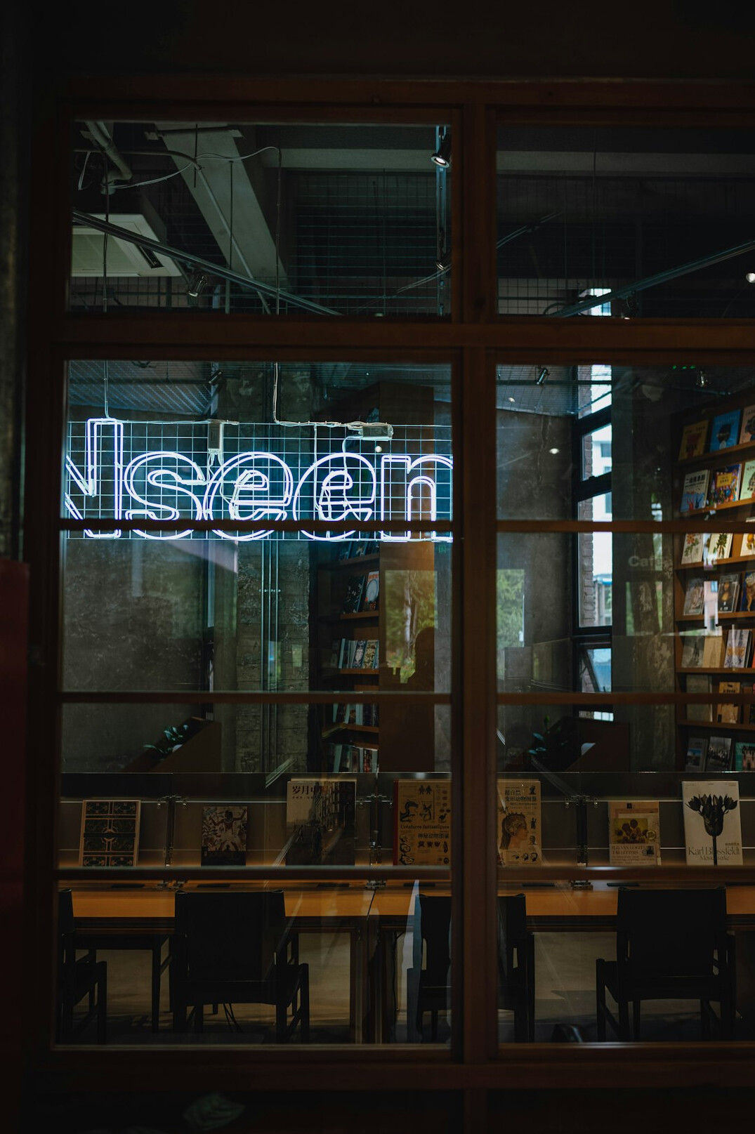 Open books and a pen on a desk in warm light