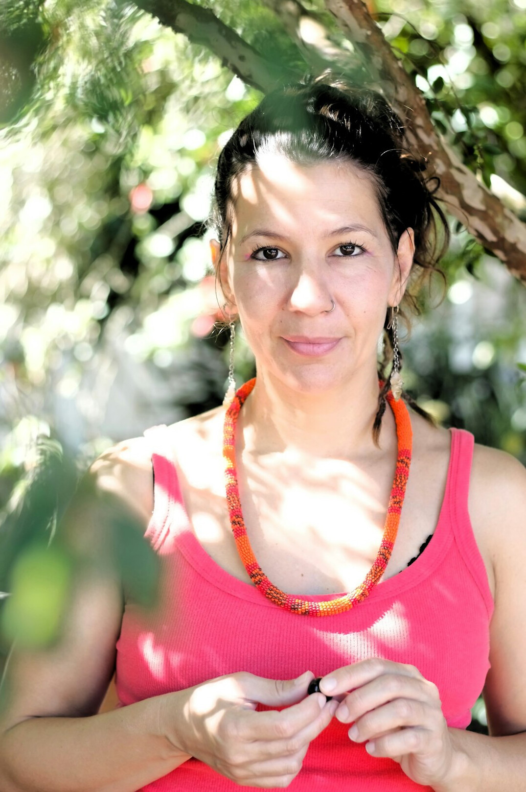 Portrait of a smiling Latina woman in her thirties